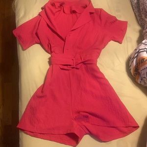 This is a jumpsuit. The size of it is medicine. It is hot pink